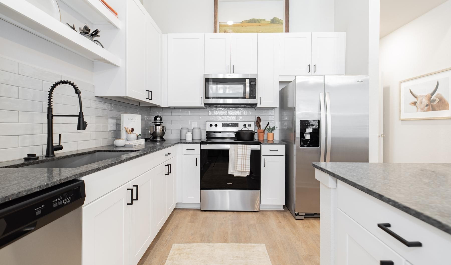 a kitchen with white cabinets