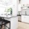 a kitchen with white cabinets