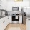 a kitchen with white cabinets