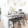 a kitchen with a dining table and chairs