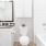 a bathroom with white cabinets