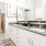 a kitchen with white cabinets