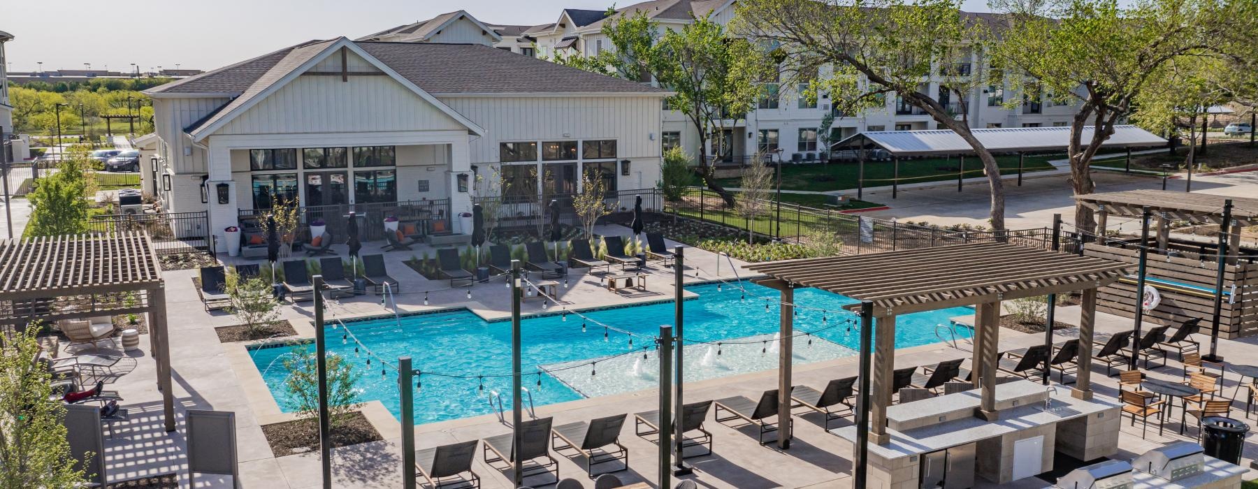 a swimming pool in front of a house