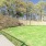 a stone wall with a stone fence and a stone wall with trees