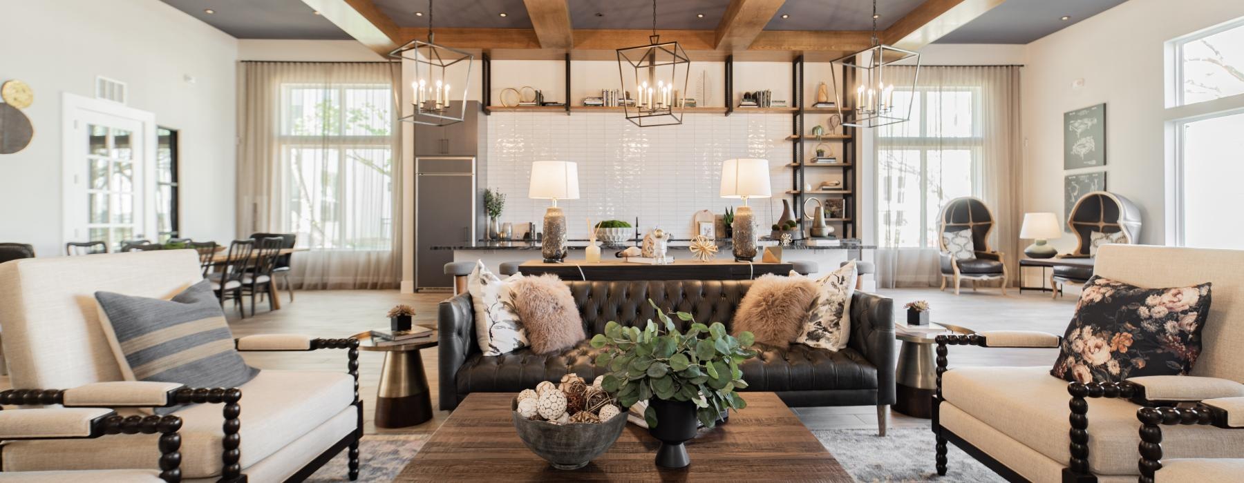 a living room with a large chandelier and a large table