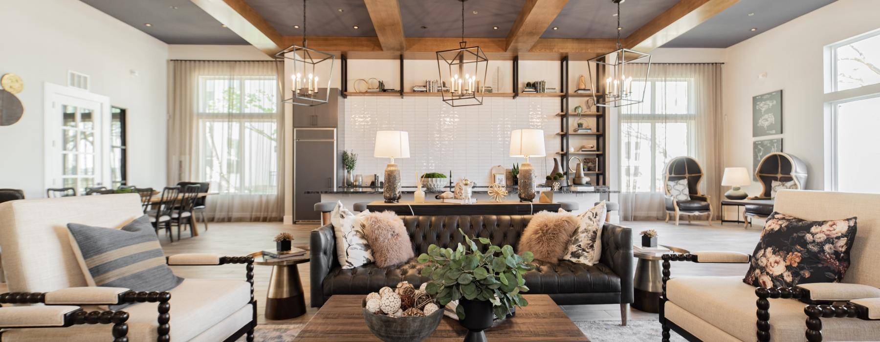 a living room with a large chandelier and a large table