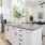 a kitchen with white cabinets